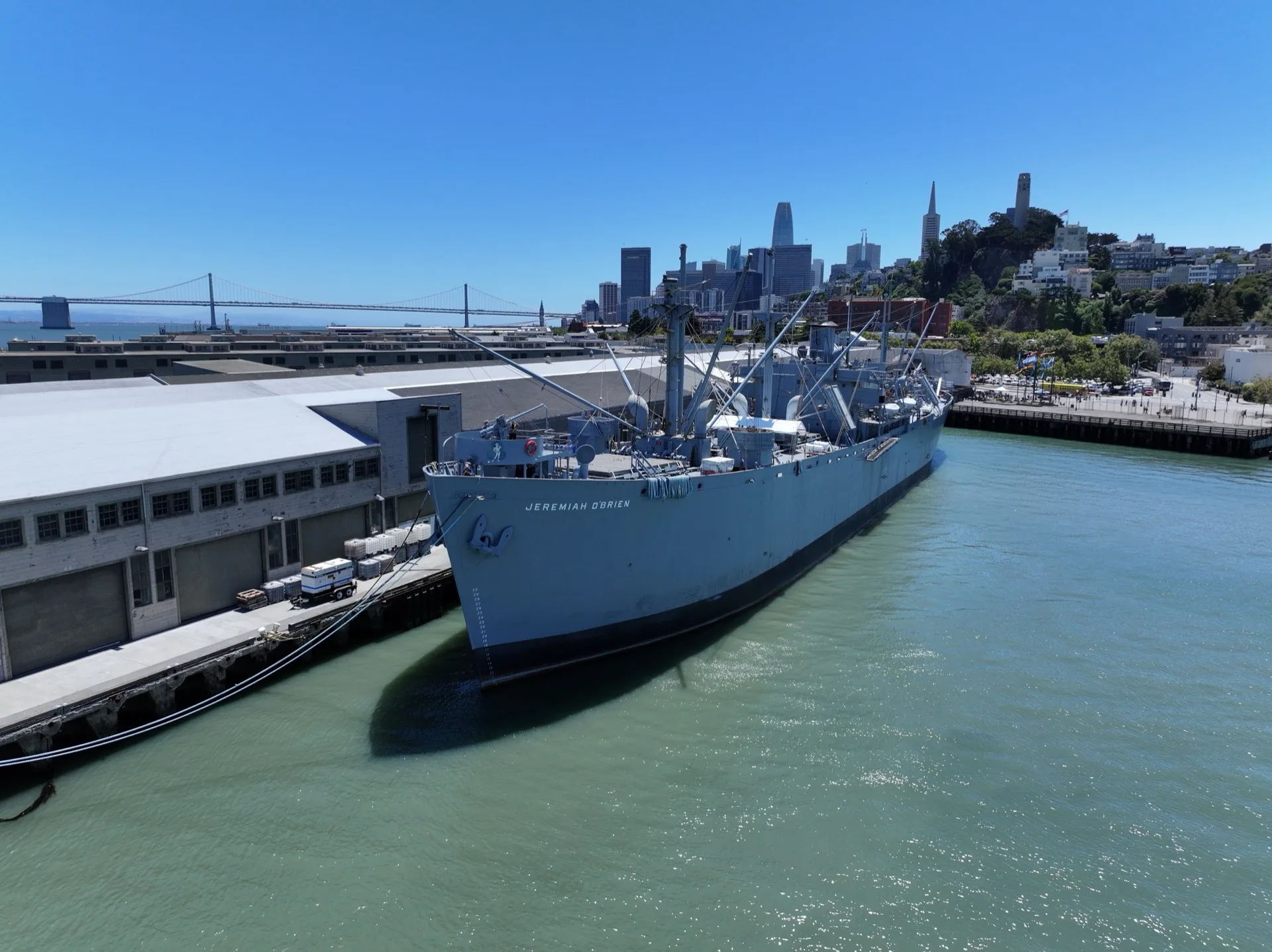 SS Jeremiah O'Brien at Pier 35, San Francisco, with Bay Bridge in background
